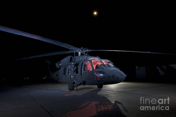 Aviation Poster featuring the photograph A Uh-60 Black Hawk Helicopter Parked by Terry Moore