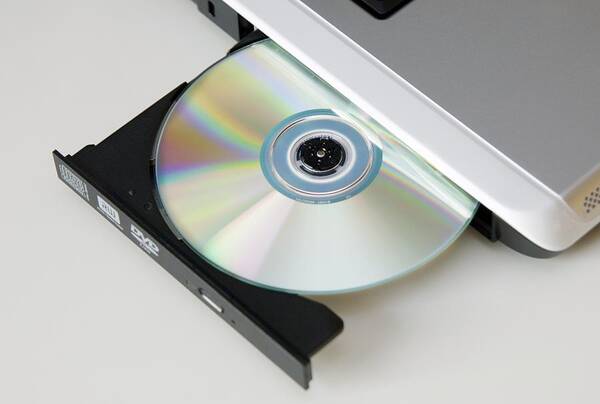 Computer Poster featuring the photograph Cd Drive On A Laptop Computer by Johnny Greig