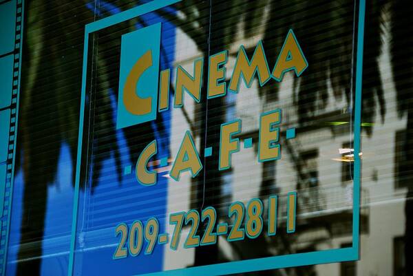 Cinema Cafe Poster featuring the photograph Cinema Cafe by Eric Tressler