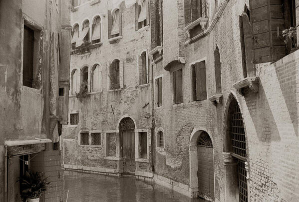 Stone Poster featuring the photograph Cozy Curved Canal Venice by Tom Wurl