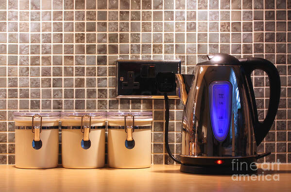 Kitchen Poster featuring the photograph Electric kettle and cup by Simon Bratt