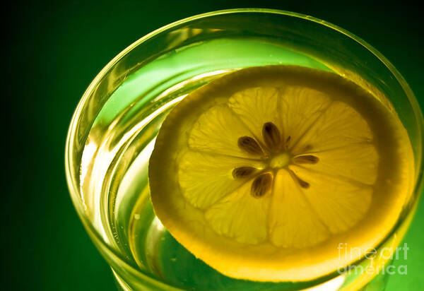 Lemon Poster featuring the photograph Lemon in the Glass of Water by Yurix Sardinelly