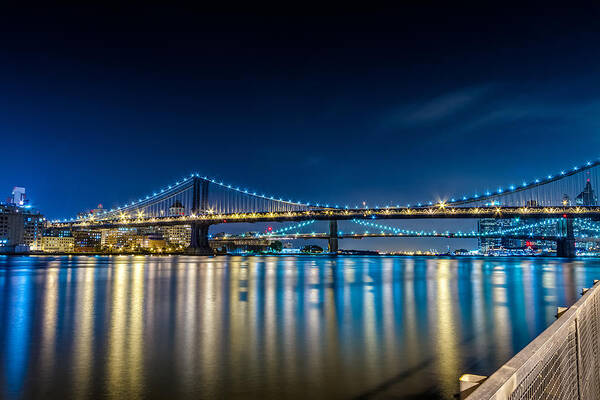 Downtown Poster featuring the photograph Manhattan Bridge and light reflections in East River. by Val Black Russian Tourchin