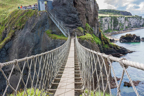 Bridge Poster featuring the photograph Rope Bridge at Carrick-a-Rede in Northern Island by Semmick Photo