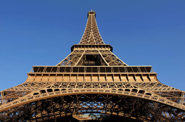 Blue Sky; Eiffel Tower; La Dame De Fer; The Iron Lady; Puddle Iron Lattice Tower; Champ De Mars; Paris; France; Global Cultural Icon; Structures; World; Architecture; Built Structure; Travel; Iron; City; Tourism; Travel Destinations; Urban Scene; Construction; Famous Place; History; Color Image; Scenics; Vacations; Sunlight; Summer; Sky; Light Poster featuring the photograph To the Point by Charel Schreuder