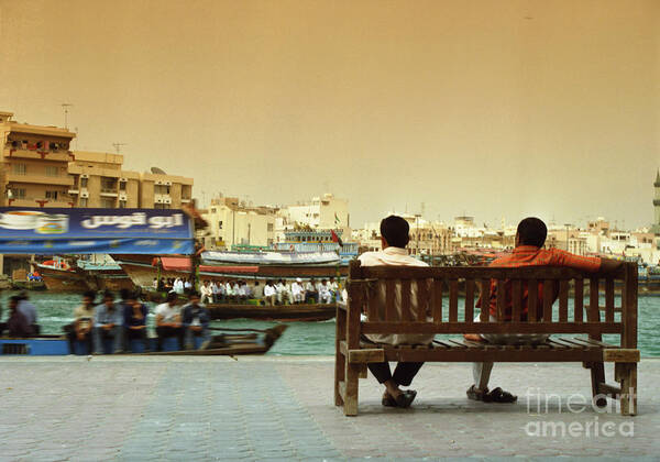 Dubai Creek Poster featuring the photograph Two Men on Bench and Boats by Lawrence Costales