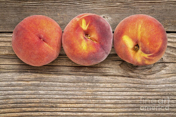 Abstract Poster featuring the photograph Peach Fruits On Weathered Wood #1 by Marek Uliasz