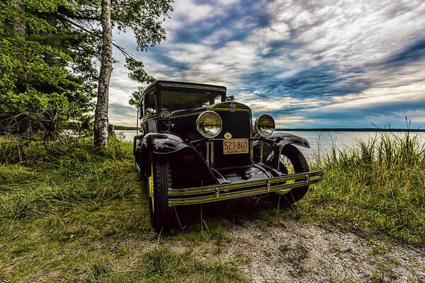 Higgins Lake Poster featuring the photograph 1930 Chevy on the shore of Higgins Lake by Joe Holley