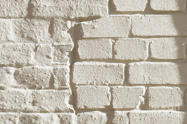 Abstract Poster featuring the photograph Weathered brick wall #3 by Tom Gowanlock