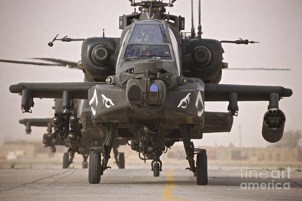 Ah-64 Poster featuring the photograph A Group Of Ah-64d Apache Helicopters by Terry Moore