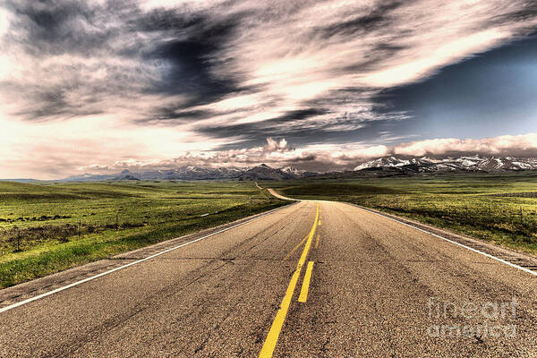 Road Poster featuring the photograph A long road to the mountains by Jeff Swan