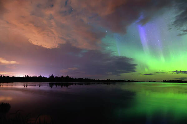 Aurora Borealis Poster featuring the photograph Aurora and Storm Clouds by Dan Jurak