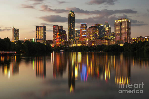 Austin Skyline Poster featuring the photograph Austin skyline cityscape at night with a glass-like reflection on Ladybird Lake by Dan Herron