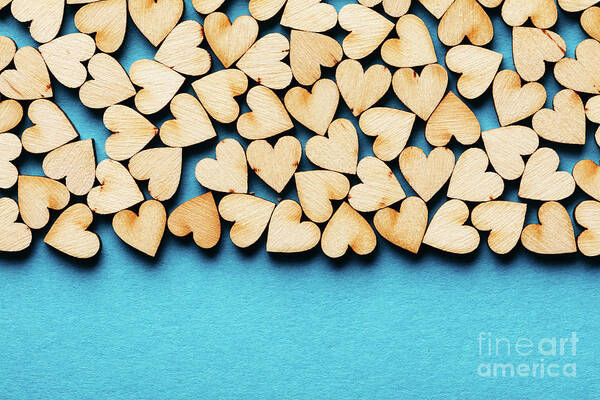 Love Poster featuring the photograph Bunch of hearts on blue background. by Michal Bednarek