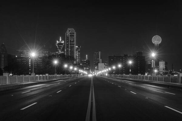 Dallas Poster featuring the photograph Crossing The Bridge to DownTown Dallas at Night in Black and White by Todd Aaron