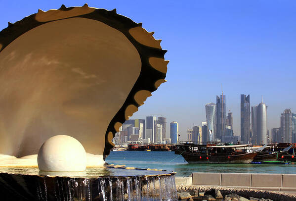 Fountain Poster featuring the photograph Doha fountain skyline and harbour by Paul Cowan