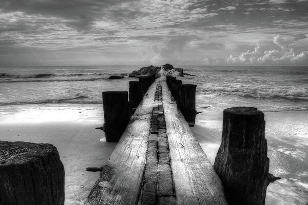Folly Beach Pilings Poster featuring the photograph Folly Beach Pilings Charleston South Carolina In Black and White by Carol Montoya