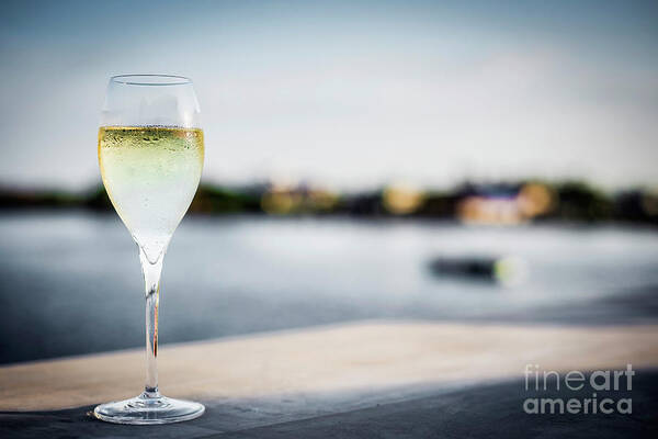 Alcohol Poster featuring the photograph Glass Of Champagne At Modern Outdoor Bar At Sunset by JM Travel Photography