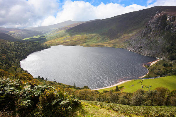 Clouds Poster featuring the photograph Guinness Lake in Wicklow Mountains Ireland by Semmick Photo