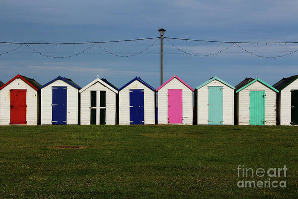 Beach Huts Poster featuring the photograph Holiday beach huts by Tom Conway