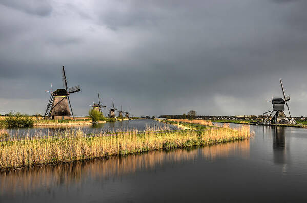 Windmill Poster featuring the photograph Kinderdijk Windmills After The Rain by Frans Blok