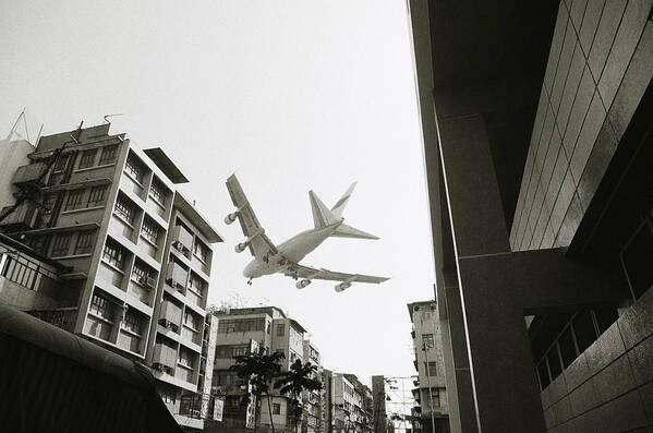 Flying Poster featuring the photograph Landing in Hong Kong by Shaun Higson