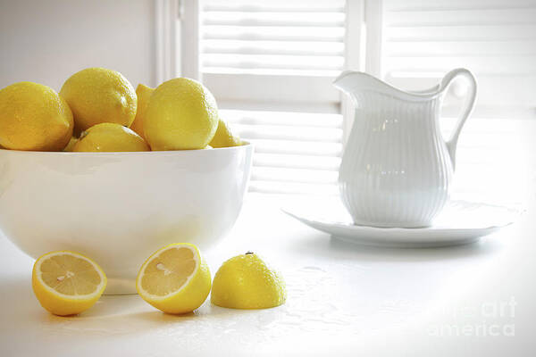 Background Poster featuring the photograph Lemons in large bowl on table by Sandra Cunningham