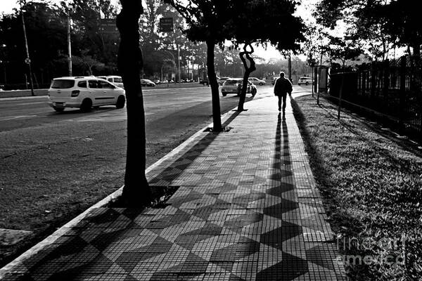 Sidewalk Poster featuring the photograph Lonely Man Walking at Dusk in Sao Paulo by Carlos Alkmin