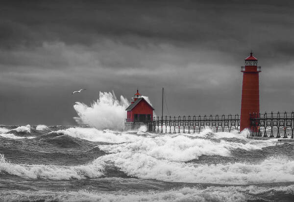 Lighthouse Poster featuring the photograph November Storm with Flying Gull by the Grand Haven Lighthouse by Randall Nyhof