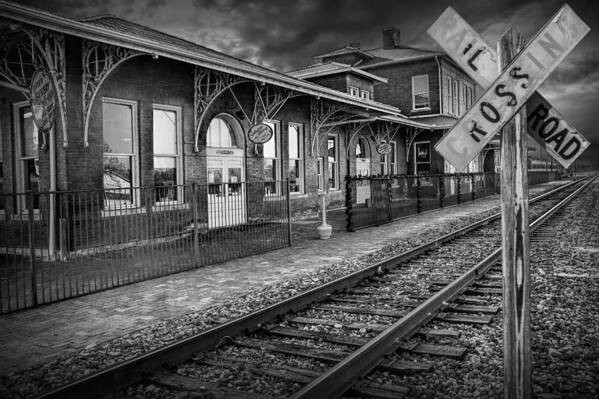 Station Poster featuring the photograph Old Train Station with Crossing Sign in Black and White by Randall Nyhof