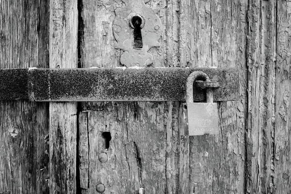 Padlock On An Old Wooden Door Poster featuring the photograph Padlock On An Old Wooden Door by Marco Oliveira