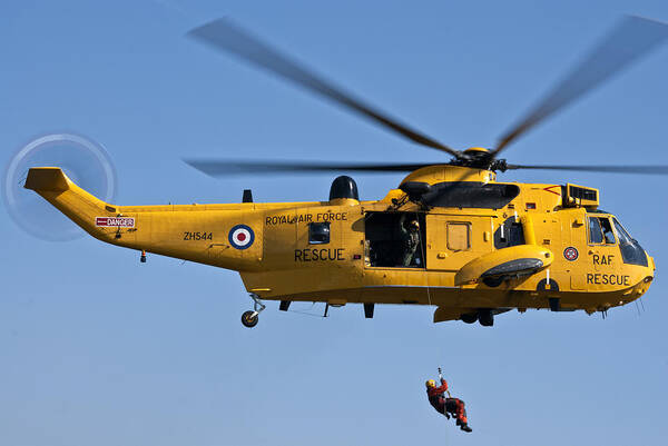 Raf Sea King Helicopter; Armed Forces; Raf; Aviation; Helicopter; Search And Rescue; Display; Sky; Yellow; Emergency Service; Sea King Helicopter; Sea King; Rescue; Flight; Nautical; Aircraft; Historic; Raf Chivenor; Chivenor Poster featuring the photograph RAF Sea King Search and Rescue Helicopter 2 by Steve Purnell