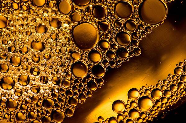 Oil And Water Water Oil Macro Closeup Gold Bruce Pritchett Photography Poster featuring the photograph River of Gold by Bruce Pritchett