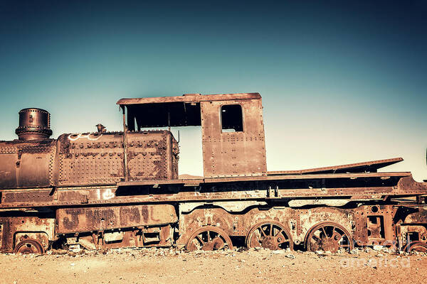 Train Poster featuring the photograph Rusty train in Uyuni, Bolivia by Delphimages Photo Creations