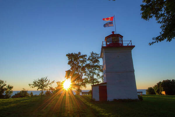 Goderich Poster featuring the photograph The Goderich Lighthouse at sunset by Jay Smith