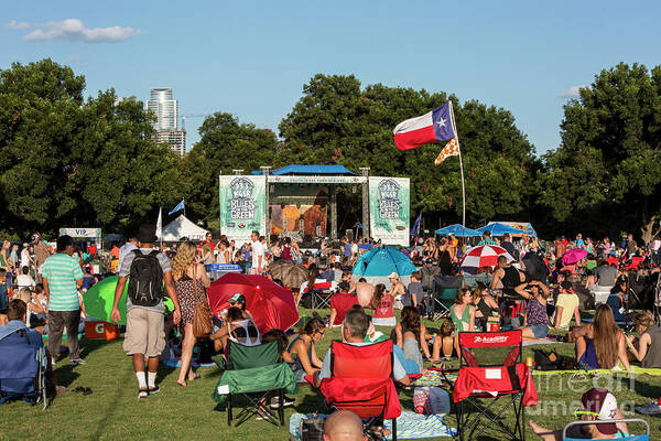 Austins Poster featuring the photograph The Texas flag boast in the wind at Austins Blues on the Green, a popular free summer concert series by Dan Herron