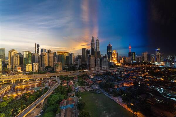 Kuala Lumpur Poster featuring the photograph Timeslice of day to night of Kuala Lumpur city by Ahmad Hafidz Abdul Kadir