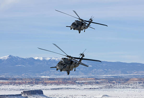 Us Air Force Poster featuring the photograph Two Hh-60g Pave Hawks Fly In Formation by HIGH-G Productions