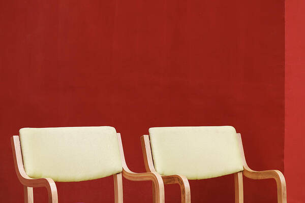 Plain Red Wall Poster featuring the photograph Two Yellow Chairs Minimalism by Prakash Ghai