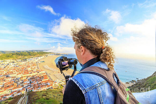 Nazare Portugal Poster featuring the photograph Video photographer in Portugal by Benny Marty