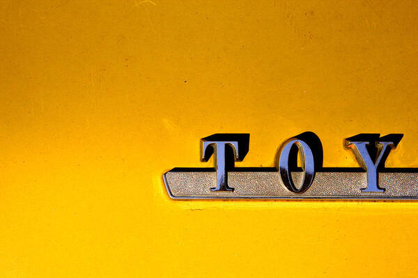 Toyota Poster featuring the photograph Yellow Toy by Kreddible Trout