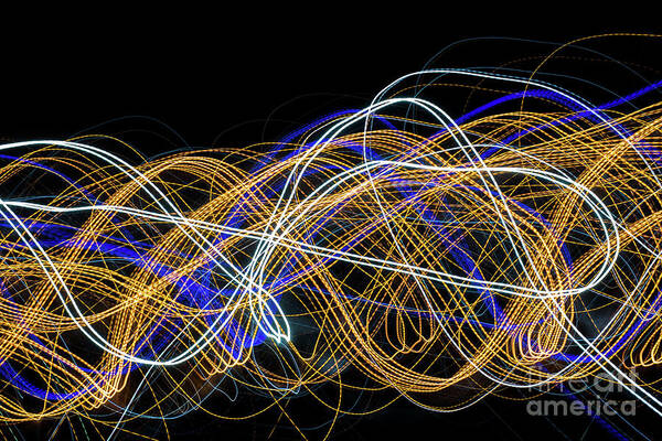 Abstract Poster featuring the photograph Colorful light painting with circular shapes and abstract black background. #1 by Joaquin Corbalan