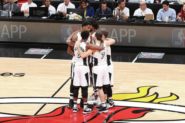 The Miami Heat Huddle Before A Game Against The Los Angeles Lakers On December 22 Poster featuring the photograph Los Angeles Lakers V Miami Heat #1 by Joe Murphy