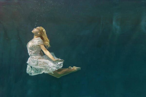 Tranquility Poster featuring the photograph Caucasian Woman In Dress Swimming Under #4 by Ming H2 Wu