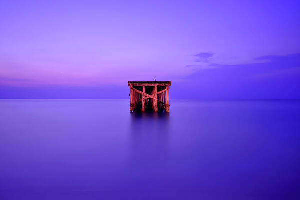 Tranquility Poster featuring the photograph Abandoned Pier In Atlantic Ocean by Shobeir Ansari