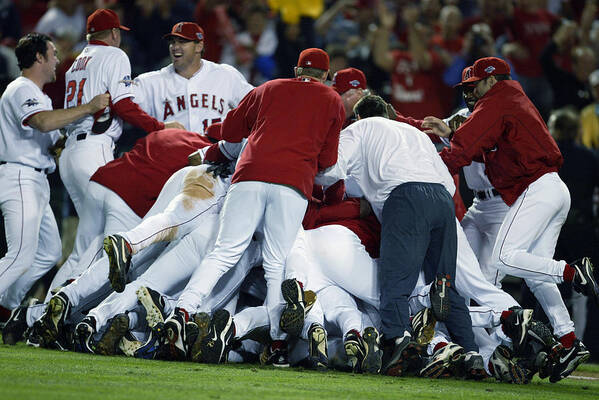 Los Angeles Angels Of Anaheim Poster featuring the photograph Angels Celebrate by Al Bello