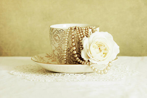 Antique Cup And Saucer With White Flower And Pearls Poster featuring the photograph Antique Cup And Saucer With White Flower And Pearls by Tom Quartermaine