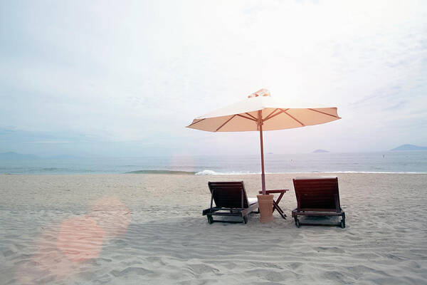 Tranquility Poster featuring the photograph Beach Loungers With Umbrella by Eternity In An Instant