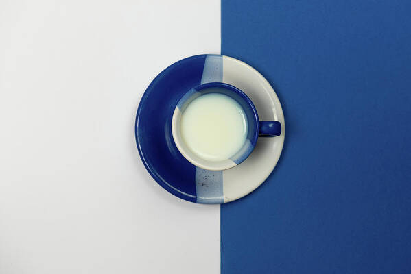 Coffee Poster featuring the photograph Blue and White coffee mug with fresh milk by Michalakis Ppalis