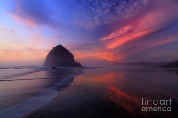 Cannon Beach Poster featuring the photograph Sunset Reflections on Beach at Haystack Rock by Tom Schwabel